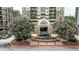 Inviting condo building entrance with meticulous landscaping and water feature, creating a welcoming atmosphere at 795 Hammond Dr # 503, Sandy Springs, GA 30328