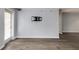 An open living room features stylish hardwood floors, neutral paint, and a mount for a flatscreen television at 795 Hammond Dr # 503, Sandy Springs, GA 30328