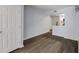 The spacious living area with hardwood floors offers a view into the modern kitchen and pantry at 795 Hammond Dr # 503, Sandy Springs, GA 30328