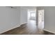The living space boasts freshly painted walls and new hardwood flooring, with an open door to the kitchen at 795 Hammond Dr # 503, Sandy Springs, GA 30328