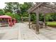 Outdoor community kitchen and picnic area with built-in grills and pergola at 795 Hammond Dr # 503, Sandy Springs, GA 30328