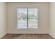 Bright bedroom featuring a window with blinds and neutral carpeting at 1006 Eagle Vw, Lawrenceville, GA 30044