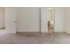 Primary bedroom with two doors, neutral carpet, and plenty of space at 1006 Eagle Vw, Lawrenceville, GA 30044
