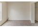 Carpeted bedroom with a large window and a closet with a louvered door, ready for personalization at 1006 Eagle Vw, Lawrenceville, GA 30044