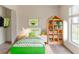 Cozy bedroom with a single bed, stylish decor, and plenty of storage space at 1006 Eagle Vw, Lawrenceville, GA 30044