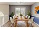Dining room with natural light, modern dining set, neutral walls, and decor at 1006 Eagle Vw, Lawrenceville, GA 30044