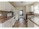 Bright kitchen with white cabinets, modern appliances, and ample counter space at 1006 Eagle Vw, Lawrenceville, GA 30044