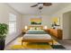 Relaxing bedroom with a neutral color palette, stylish rug, and modern furniture at 1006 Eagle Vw, Lawrenceville, GA 30044
