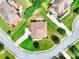 Aerial view of the property featuring a manicured lawn, patio, and charming neighborhood at 2458 Brook Park Trl, Snellville, GA 30078