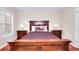 Bedroom with a wooden bed frame and matching nightstands at 2458 Brook Park Trl, Snellville, GA 30078