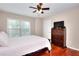 Cozy bedroom with ceiling fan, and a dresser with TV at 2458 Brook Park Trl, Snellville, GA 30078