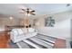 Open bonus room with a cozy couch and striped rug, perfect for relaxation at 2458 Brook Park Trl, Snellville, GA 30078