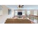 Bonus room featuring a comfortable couch and large windows for natural light at 2458 Brook Park Trl, Snellville, GA 30078