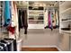 Organized walk-in closet with shelving and hanging storage at 2458 Brook Park Trl, Snellville, GA 30078