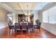 Elegant dining area with hardwood floors, wainscoting, and a coffered ceiling at 2458 Brook Park Trl, Snellville, GA 30078