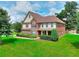 Attractive brick and siding two-story home with a well-maintained lawn and manicured landscaping at 2458 Brook Park Trl, Snellville, GA 30078