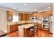 Spacious kitchen with custom cabinetry, granite countertops, and a large center island at 2458 Brook Park Trl, Snellville, GA 30078