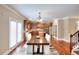 Open kitchen and breakfast nook with hardwood floors and stainless steel appliances at 2458 Brook Park Trl, Snellville, GA 30078