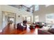 Bright living room with high ceilings, hardwood floors and comfortable leather furniture at 2458 Brook Park Trl, Snellville, GA 30078