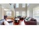 Open floor plan living room showcasing hardwood floors and large windows at 2458 Brook Park Trl, Snellville, GA 30078