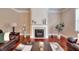 Inviting living room with a fireplace, hardwood floors and comfortable seating at 2458 Brook Park Trl, Snellville, GA 30078