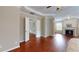 Spacious main bedroom with hardwood floors and views to fireplace and seating area at 2458 Brook Park Trl, Snellville, GA 30078