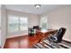 Bright home office with wood desk and large windows for natural light at 2458 Brook Park Trl, Snellville, GA 30078