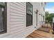 Spacious townhome balcony with wood flooring and black railing, perfect for relaxation and outdoor entertaining at 2461 Sycamore Nw Rd, Atlanta, GA 30318