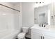 Bright bathroom with shower-tub combo, white vanity, and matte black fixtures at 2461 Sycamore Nw Rd, Atlanta, GA 30318
