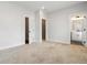 This bedroom offers neutral walls and carpet, with two door entries at 2461 Sycamore Nw Rd, Atlanta, GA 30318