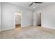 Bedroom featuring neutral walls, carpet, ceiling fan and access to bathroom at 2461 Sycamore Nw Rd, Atlanta, GA 30318