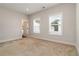 Neutral bedroom with carpet, two windows, white trim and attached bathroom at 2461 Sycamore Nw Rd, Atlanta, GA 30318