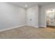Bedroom featuring carpet, closet, and an adjacent bathroom at 2461 Sycamore Nw Rd, Atlanta, GA 30318