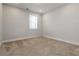 Cozy bedroom with neutral carpet, ample natural light, and a clean, modern design at 2461 Sycamore Nw Rd, Atlanta, GA 30318