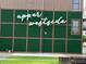 Upper Westside community sign with a lush green wall, highlighting the neighborhood's welcoming vibe at 2461 Sycamore Nw Rd, Atlanta, GA 30318