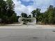 Scenic entrance to the Atlanta Botanical Garden featuring unique, modern architecture and lush landscaping at 2461 Sycamore Nw Rd, Atlanta, GA 30318
