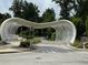 Striking architectural entrance to the Atlanta Botanical Garden surrounded by verdant trees and landscaping at 2461 Sycamore Nw Rd, Atlanta, GA 30318