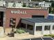 The Woodall featuring patio seating and dining options in a trendy and walkable neighborhood location at 2461 Sycamore Nw Rd, Atlanta, GA 30318