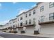 Row of townhomes with garage, each featuring a private balcony, enhancing outdoor living space and curb appeal at 2461 Sycamore Nw Rd, Atlanta, GA 30318