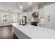 Modern kitchen featuring stainless steel appliances, white cabinets, and a large island at 2461 Sycamore Nw Rd, Atlanta, GA 30318