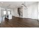 Spacious living room with open floor plan, leading to kitchen and staircase at 2461 Sycamore Nw Rd, Atlanta, GA 30318