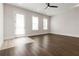 Bright living room featuring hardwood floors, recessed lighting, and access to the outdoors at 2461 Sycamore Nw Rd, Atlanta, GA 30318