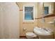 Classic bathroom with tiled walls, vanity, toilet, shower and window at 2790 Laurel Ridge Dr, Decatur, GA 30033