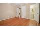 Bedroom with ensuite bathroom, hardwood floors, and views into other rooms at 2790 Laurel Ridge Dr, Decatur, GA 30033