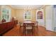 Bright dining room featuring a charming chandelier and beautiful hardwood floors, perfect for entertaining at 2790 Laurel Ridge Dr, Decatur, GA 30033