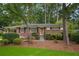 Charming brick home featuring a welcoming entrance and mature landscaping, creating inviting curb appeal at 2790 Laurel Ridge Dr, Decatur, GA 30033