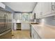 Bright kitchen with stainless steel appliances, white cabinets, and ample counter space for cooking and meal preparation at 2790 Laurel Ridge Dr, Decatur, GA 30033
