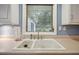 Close-up on kitchen sink area, highlighting the countertop space and natural light from the window above at 2790 Laurel Ridge Dr, Decatur, GA 30033
