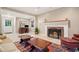 Inviting living room featuring a fireplace, rug, ceiling fan and access to the entryway and study at 2790 Laurel Ridge Dr, Decatur, GA 30033