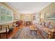 Inviting living room with hardwood floors, classic furnishings, and abundant natural light through shuttered windows at 2790 Laurel Ridge Dr, Decatur, GA 30033